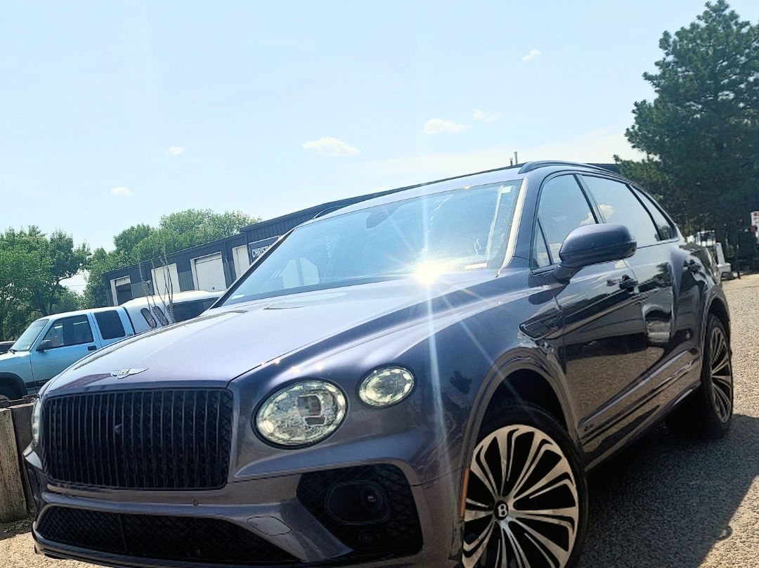 Purple Bentley Bentayga at Christian's Automotive after cooling system repair and ADAS calibration