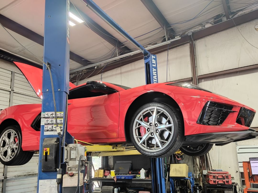 C8 Corvette raised on a Rotary lift for performance maintenance at Christian's Automotive